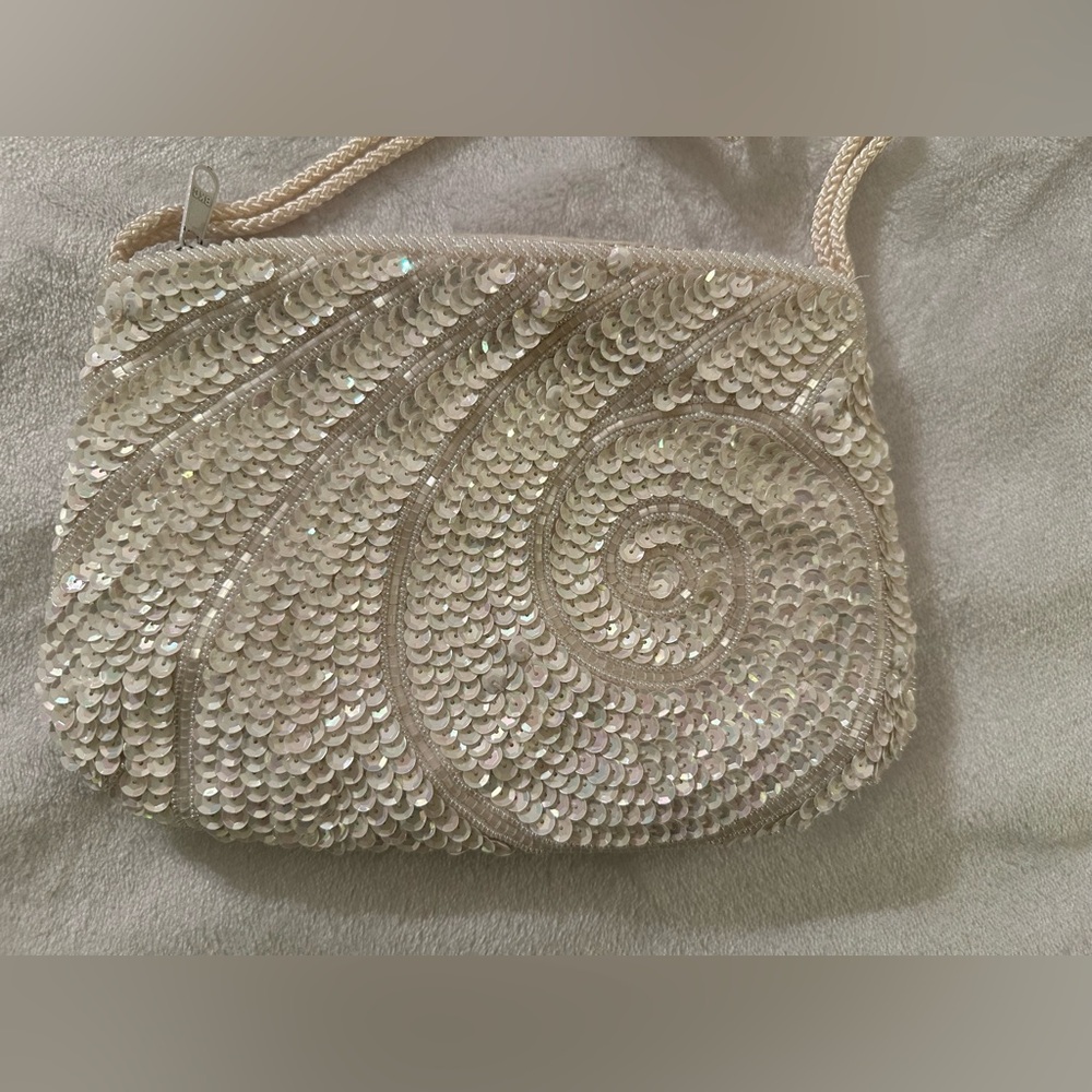 La Regale white sequin crossbody evening bag.
